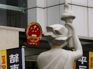 A statue of the Goddess of Democracy is displayed outside the China Liaison Office during a pro-democracy protest in Hong Kong