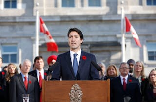 Prime Minister Justin Trudeau speaks to the crowds outside Rideau Hall after the Cabinet's swearing-in ceremony in Ottawa