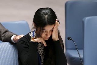 Basee, a 21-year-old Iraqi woman of the Yazidi faith, reacts after speaking to members of the Security Council during a meeting 