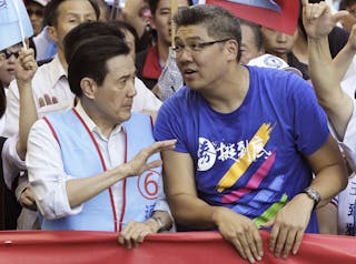 Taiwan's President Ma speaks to Lien, KMT's Taipei mayor candidate, during an campaign rally ahead of the election in Taipei