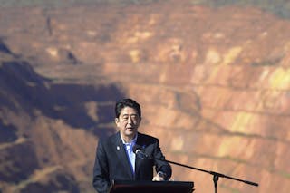 Japanese Prime Minister Shinzo Abe delivers remarks during a tour of the Rio Tinto West Angelas iron ore mine in the Pilbara reg