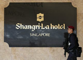 A Special Operations Command member patrols outside the venue of the IISS' Shangri-La Dialogue in Singapore