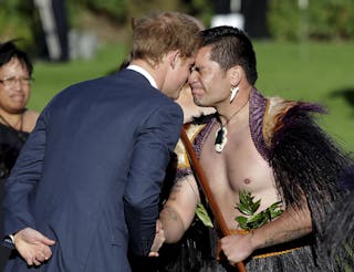 Britain's Prince Harry receives a hongi during his official welcome at Government House in Wellington