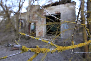 Ruined house is seen in the abandoned village of Vorotets