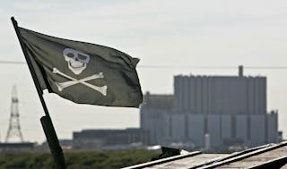 - PHOTO TAKEN 03OCT05 - A 'skull and crossbones' flag flies near the Dungeness nuclear power station..