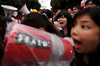 Members of protest group Students Emergency Action for Liberal Democracy, shout slogans during a rally against Japan's Prime Min