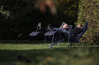 People enjoy the sunny weather in a park in Mannheim