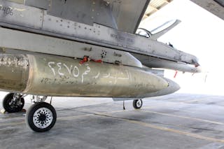 Bombs are pictured on a Royal Jordanian Air Force plane at an air base before it's launch to strike the Islamic state in the Syr