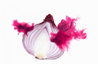 Half a red onion with corresponding coloured digital burst effect