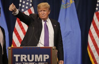 Republican U.S. presidential candidate Donald Trump gives a thumbs up after addressing supporters after being declared by the te