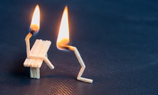 Two burning matches on black background. Husband apologizing wife. Man asking woman for forgivness. Boyfriend trying to convince