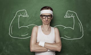 Funny sport nerd with fake muscle drawn on the chalkboard