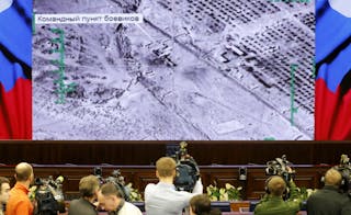 Journalists attend a briefing at the headquarters of Russia's defence ministry in Moscow