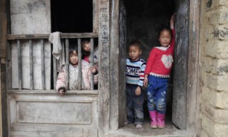 Yuanyang city, China - JAN 1, 2018: Unknown Chinese children was acting same as model in front of their house \in Hani village, 