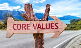 Core Values wooden sign with a street background — Photo by gustavofrazao