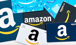 Montreal, Canada - April 6, 2020: Different Amazon gift cards. Amazon is a titan of e-commerce, payments, hardware, data storage