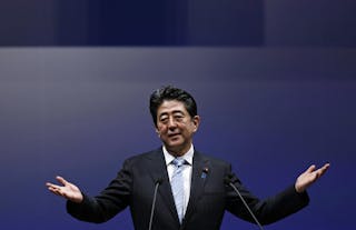 Japan's PM Abe gestures as he delivers his speech during the ruling Liberal Democratic Party annual convention in Tokyo