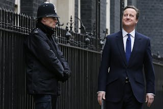 Britain's Prime Minister Cameron leaves Number 10 Downing Street, as he heads to Buckingham Palace to meet with Queen Elizabeth,