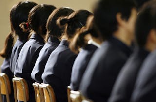 Pupils listen to Midori Komori, whose daughter Kasumi Komori committed suicide because of bullying on July 27, 1998 at the age o