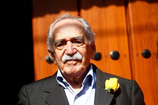 Colombian author Gabriel Garcia Marquez stands outside his house on his 87th birthday in Mexico City