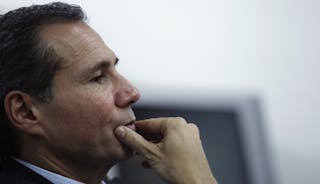 Argentine prosecutor Nisman, who is investigating the 1994 car-bomb attack on the AMIA Jewish community center, pauses during a 