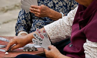 Women playing cards, gambling with stones, Daxu ancient town, Guangxi, China - Image