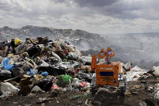 A replica of Wall-E character built by a Bolivian student Esteban Quispe is seen near a rubbish dump in Patacamaya, south of La 