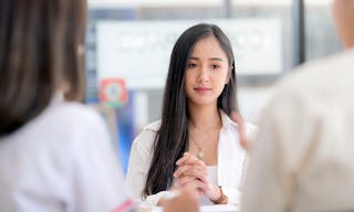 Young asian women feel unconfident and worried while interviewing for a job in modern office.