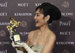 Taiwanese actress Chen Shiang-chyi celebrates winning the Best Leading Actress for "Exit" at the 51st Golden Horse Film Awards i