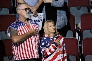 Audience members stand for the U.S. National Anthem at a campaign rally with U.S. Republican presidential candidate Donald Trump in Bangor, Maine, June 29, 2016. REUTERS/Brian Snyder - RTX2IXWO