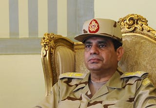 Egypt's Defense Minister Abdel Fattah al-Sisi is seen during a news conference in Cairo on the release of seven members of the E