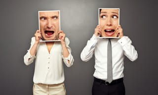 man and woman holding screaming faces. concept photo over grey background