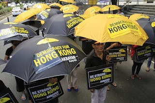 Activists hold a protest in a Chinese Consular office in Makati city, metro Manila