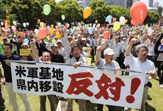 Local residents protest against the plan to relocate the U.S. military base there from Okinawa, in Kagoshima