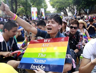 A protester shouts slogans during a rally to urge Taiwan's parliament to consider a bill that could legalize same-sex marriage o