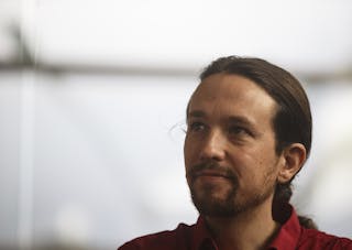 Spain's Podemos Party secretary general Iglesias listens to a question during a news conference evaluating Greece's election res