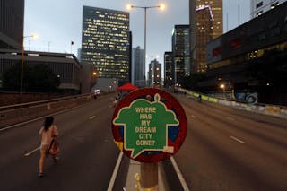 A sign is displayed by pro-democracy protesters on a vehicle bridge during the Occupy Central civil disobedience movement at the