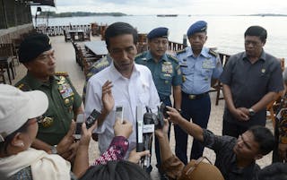 Indonesian President Joko Widodo speaks to the media about AirAsia Flight QZ8501 in Sorong, West Papua,