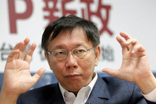 柯文哲 Ko gestures while answering a question during an interview with Reuters in Taipei