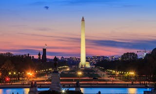 Washington DC city view at a orange sunset, including Washington Monument from Capitol building