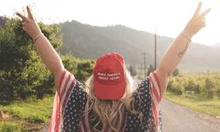 Wenatchee, Washington - July 4, 2019: Republican woman wearing a MAGA hat (Make America Great Again) supporting President Donald