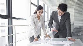 08 May 2015 --- Young business person talking in meeting room --- Image by © Lane Oatey/Blue Jean Images/Corbis