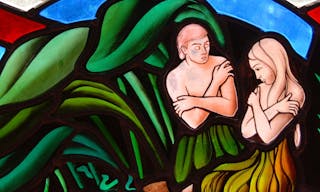 Stained Glass window segment of Adam and Eve in the Garden of Eden