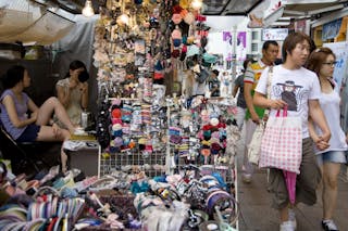 Shoppers walk through the many shops open at Dongdaemun Market.