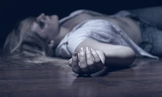 The dead woman&#039;s body. Focus on hand