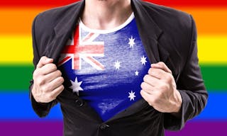 Businessman stretching suit with Australia Flag with rainbow flag，澳洲、彩虹旗、多元性別、LGBTIQ+