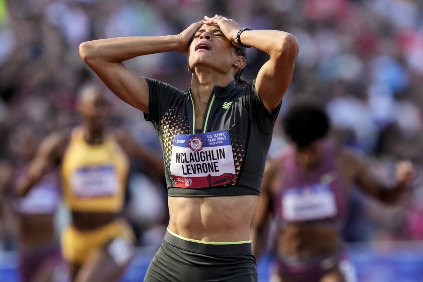 Sydney McLaughlin-Levrone reacts to winning the women's 400-meter hurdles final.