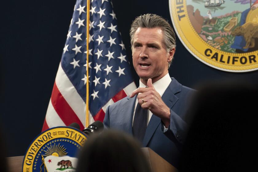 FILE - California Gov. Gavin Newsom answers a reporters question about his revised 2024-25 state budget during a news conference in Sacramento, Calif., Friday, May 10, 2024. Newsom used his State of the State address on Tuesday, June 25, 2024, to boost President Joe Biden ahead of Thursday's pivotal presidential debate, comparing Donald Trump's version of the Republican Party to the rise of fascism prior to World War II and offering Democrats' ideals as "an antidote to the poisonous populism of the right." (AP Photo/Rich Pedroncelli, File)