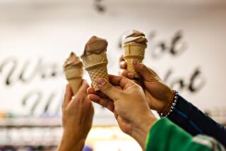 Los Angeles, CA - March 28: People enjoy a vegan ice cream cone after their weekly run with the Vegan Run Club at vegan grocery store Besties in East Hollywood, which ends back at the store where everyone gets free soft serve ice cream on Thursday, March 28, 2024 in Los Angeles, CA. (Jason Armond / Los Angeles Times)