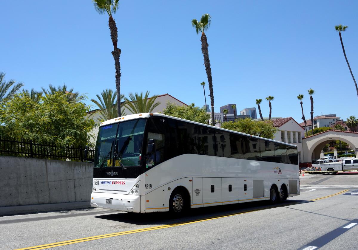 A bus carrying migrants from Texas arrives at L.A.'s Union Station on July 14